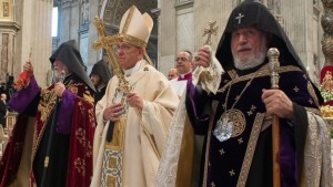  In this Sunday, April 12, 2015 pool photo Pope Francis, center, flanked by the head of Armenia's Orthodox Church Karekin II, right, and Catholicos Aram I, left.